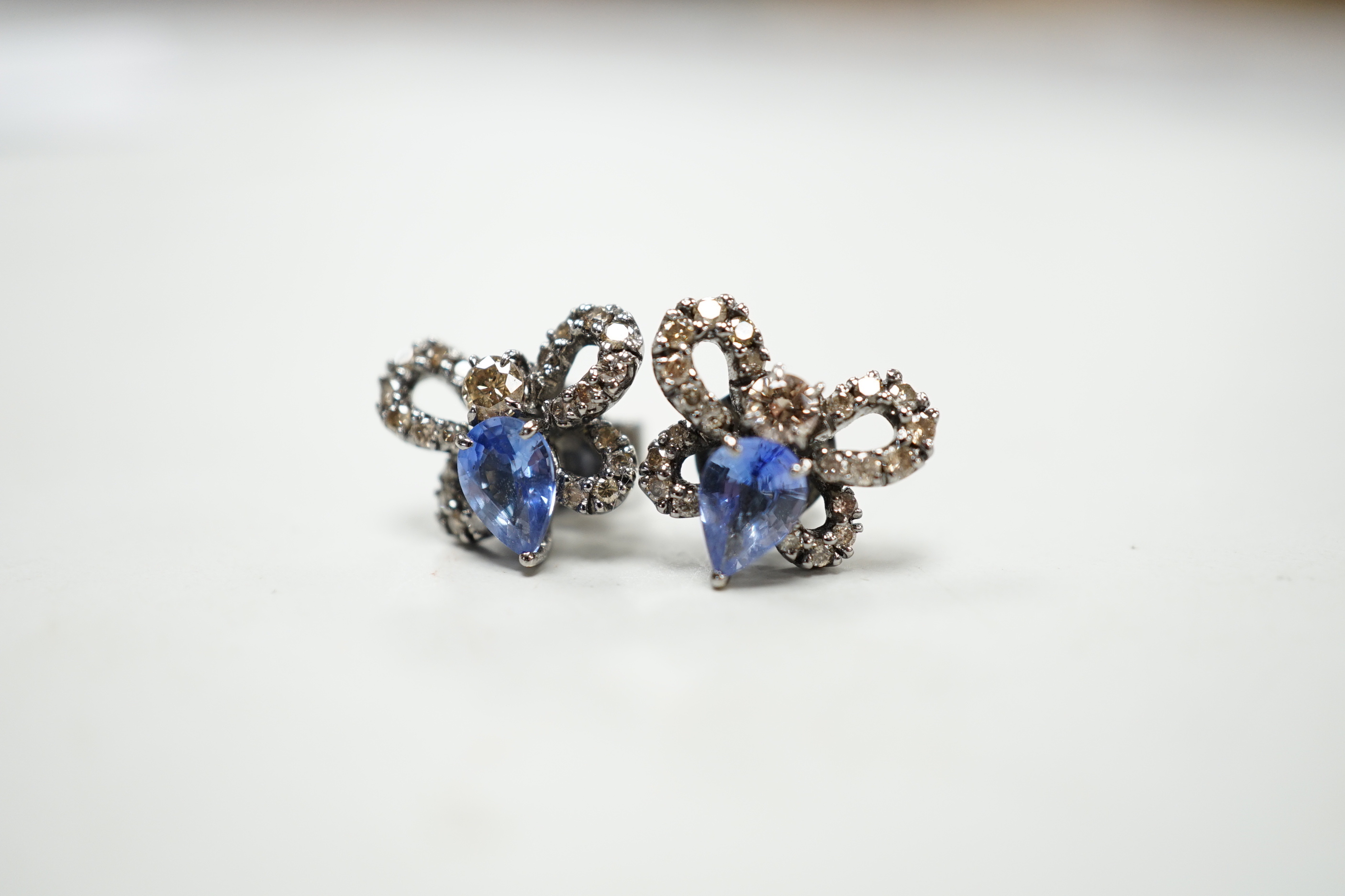 A pair of 750 white metal, sapphire and diamond cluster set bug earrings, width 13mm, gross weight 3.8 grams.